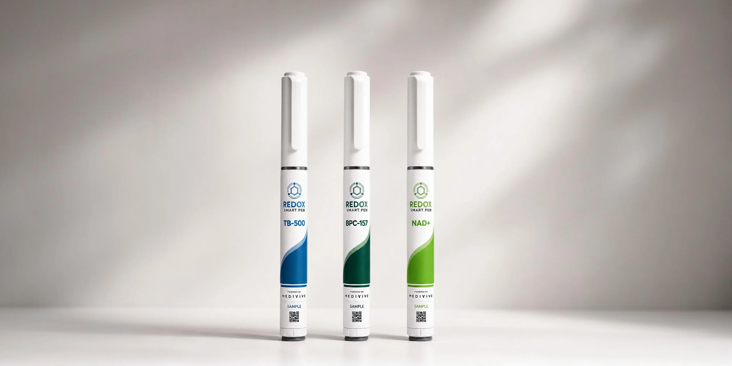 Three Redox Smart Pens for TB-500, BPC-157 and NAD+ standing upright on a white surface
